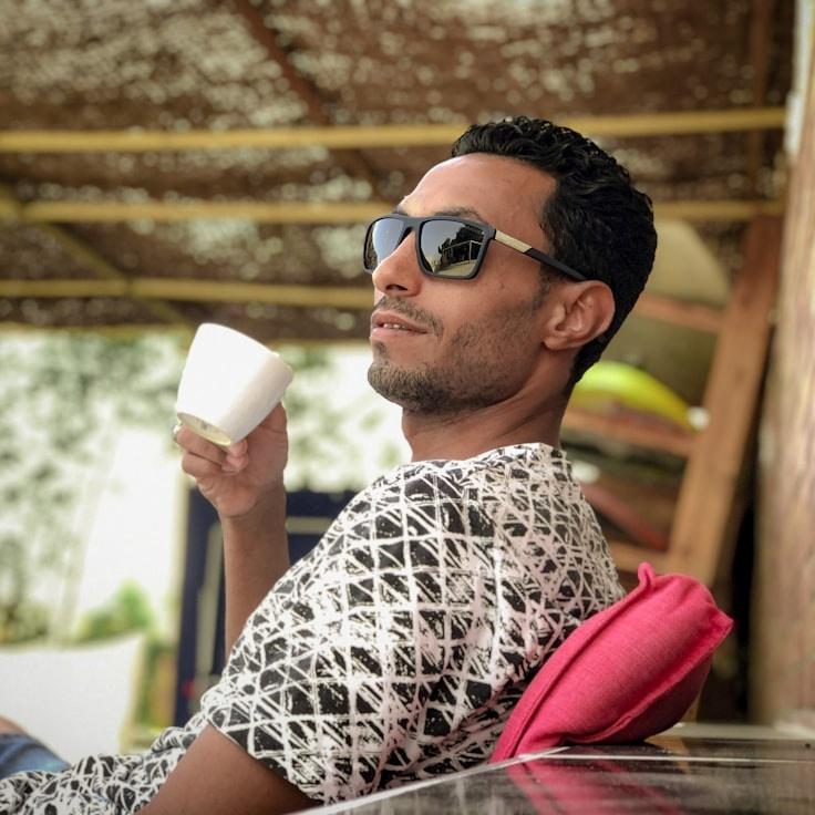 Kaveri Mehta, Lead Design Curator at VoyageHarborPulse, reviewing corporate floral arrangements